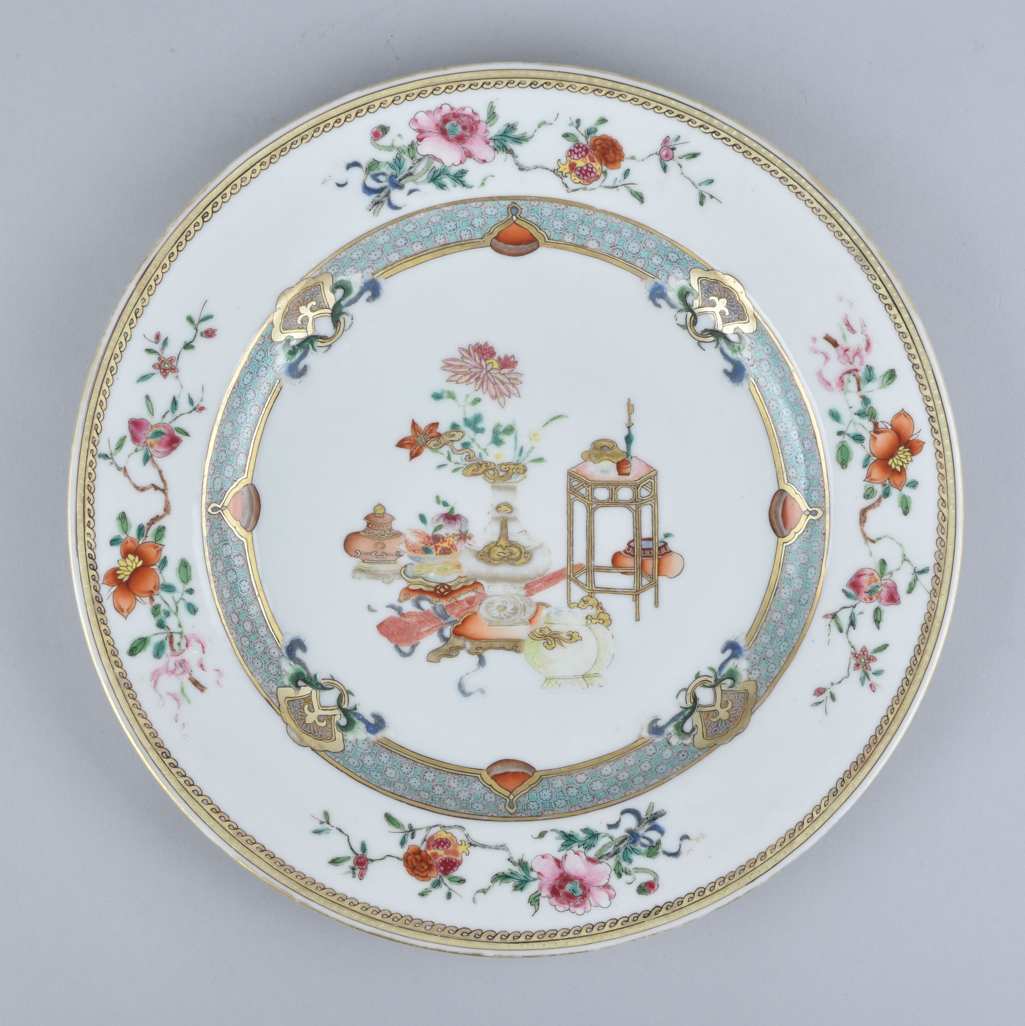 A Chinese famille rose plate decorated with “The Hundred Antiquities ...