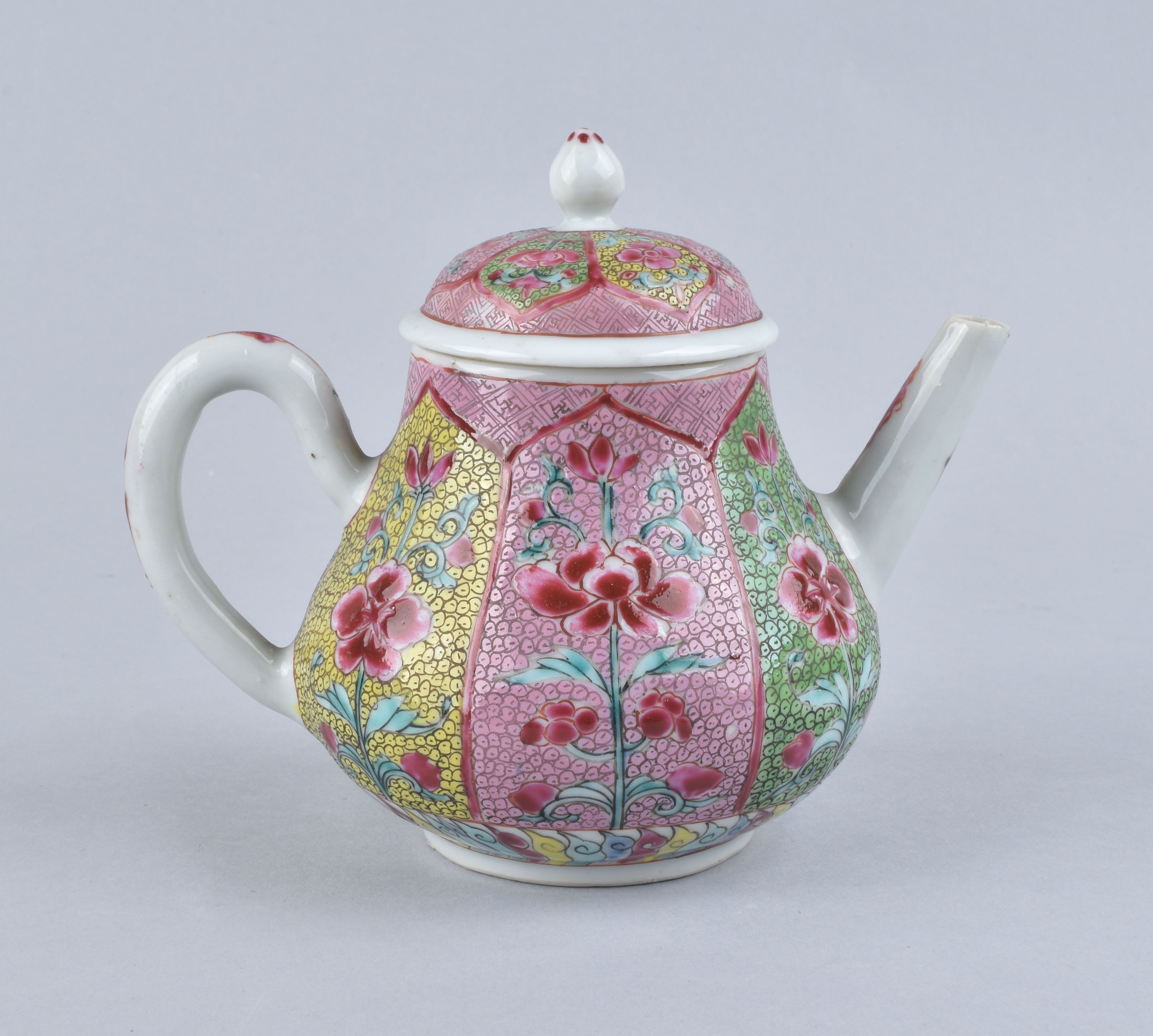 A Chinese famille rose lotus teapot. Yongzheng